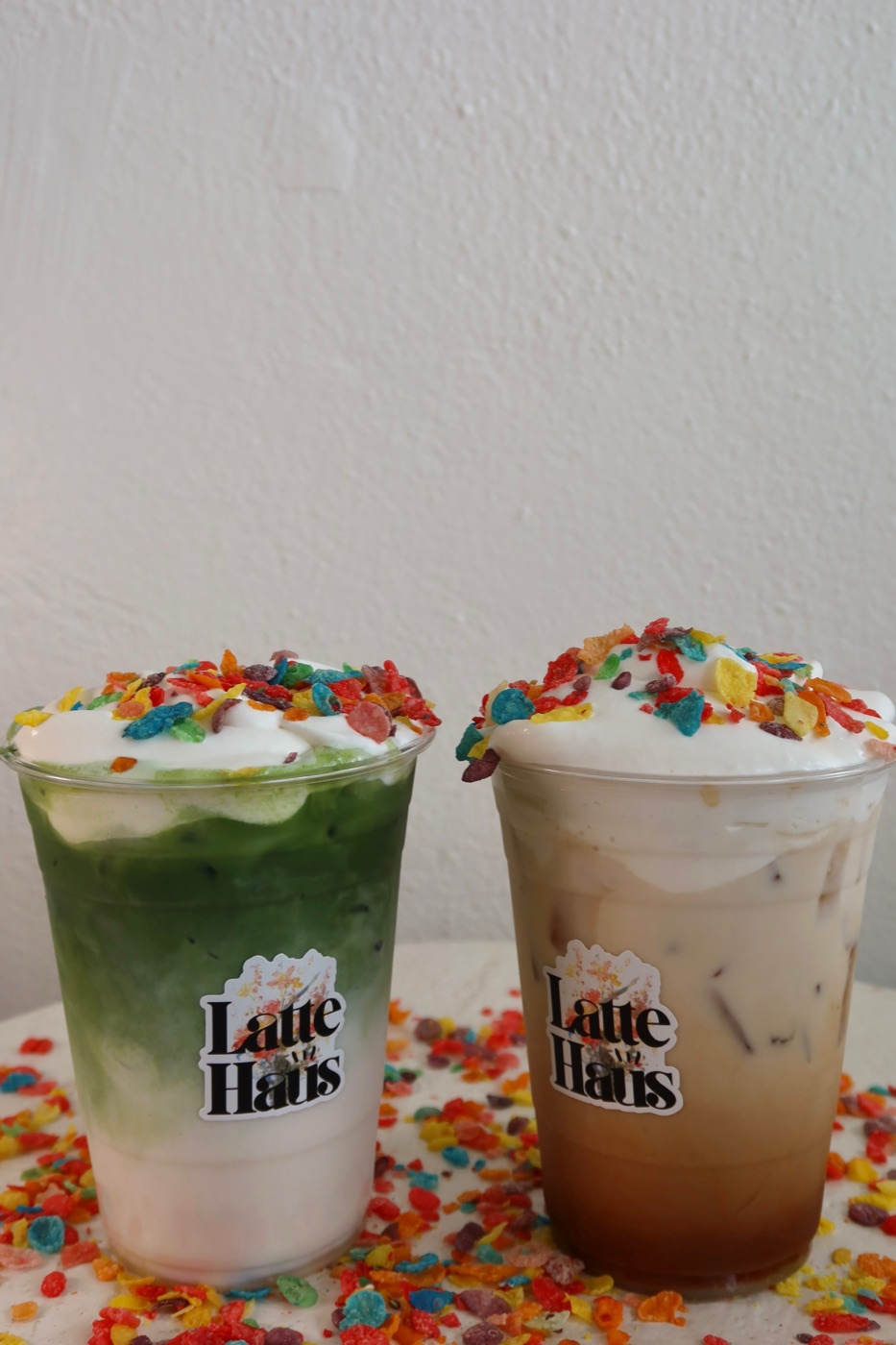 Fruity Pebbles Lattes at Latte Haus — matcha and coffee topped with whipped cream and cereal